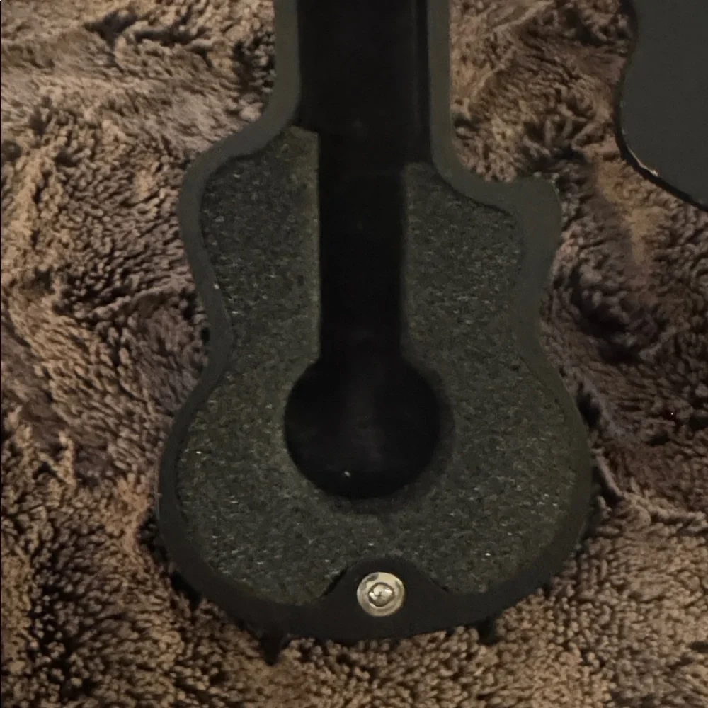 The Beatles Apple Corps Ltd. watch in its original wooden guitar-shaped case.